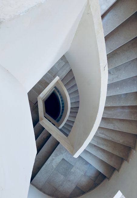 Abstract view of a spiral staircase with a modern architectural style.