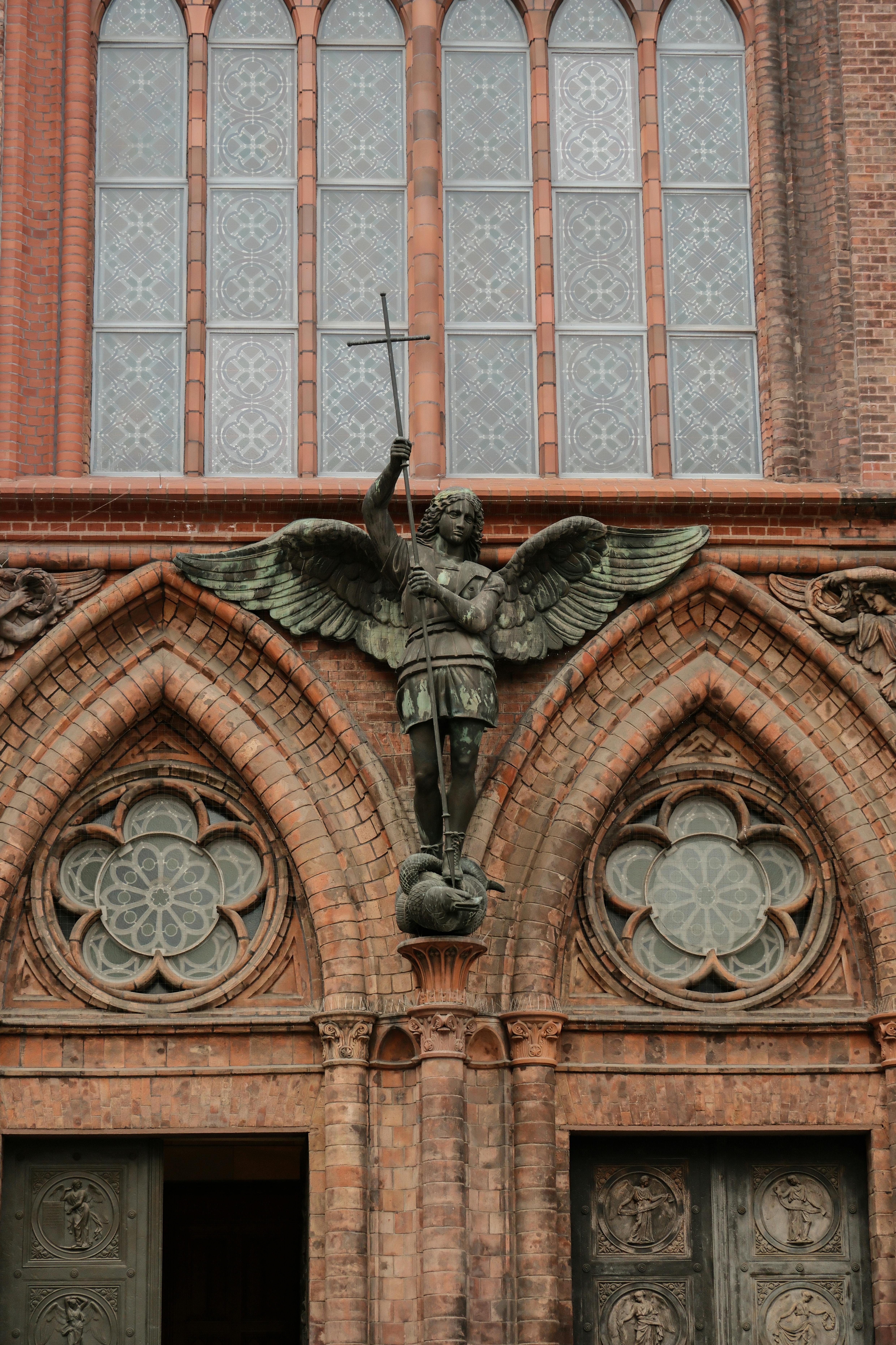 Free A detailed view of a Gothic facade with an ornate angel statue in Berlin, Germany. Stock Photo