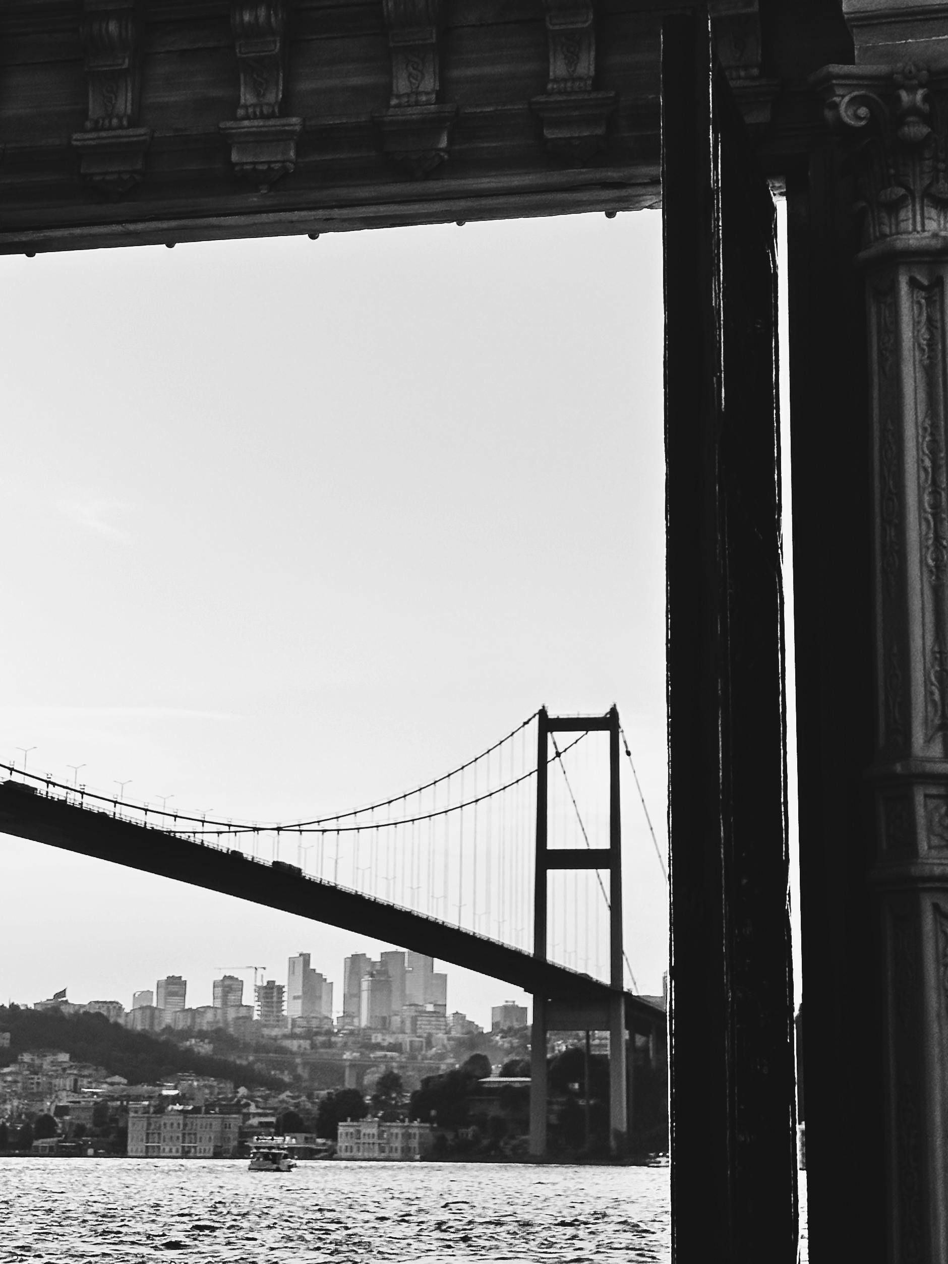 Free Captivating black and white photo of Istanbul's Bosphorus Bridge with cityscape. Stock Photo