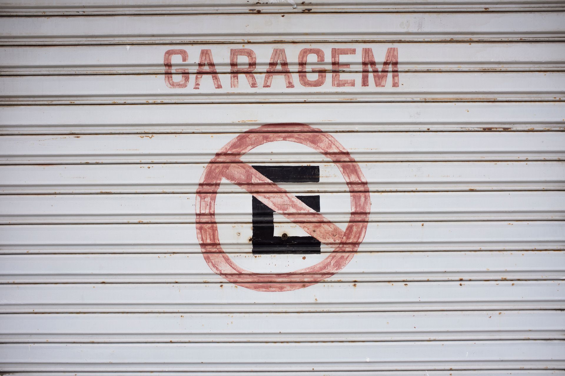 Garage door with no parking sign
