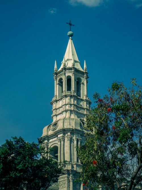 Free Captivating view of a historic cathedral bell tower in Arequipa, Peru under a clear blue sky. Stock Photo