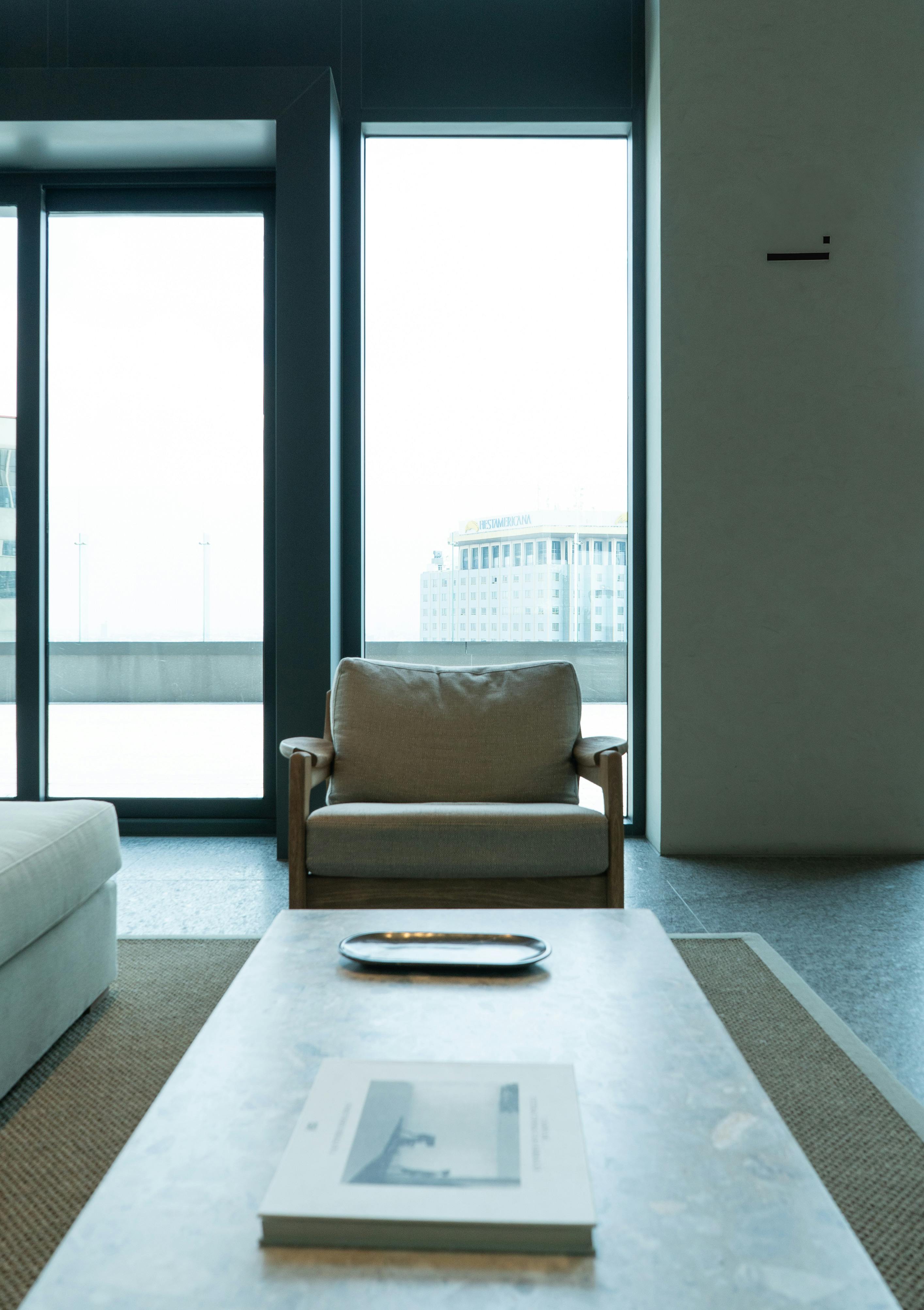 A sophisticated home theater with dark walls, ambient lighting, and comfortable seating.
