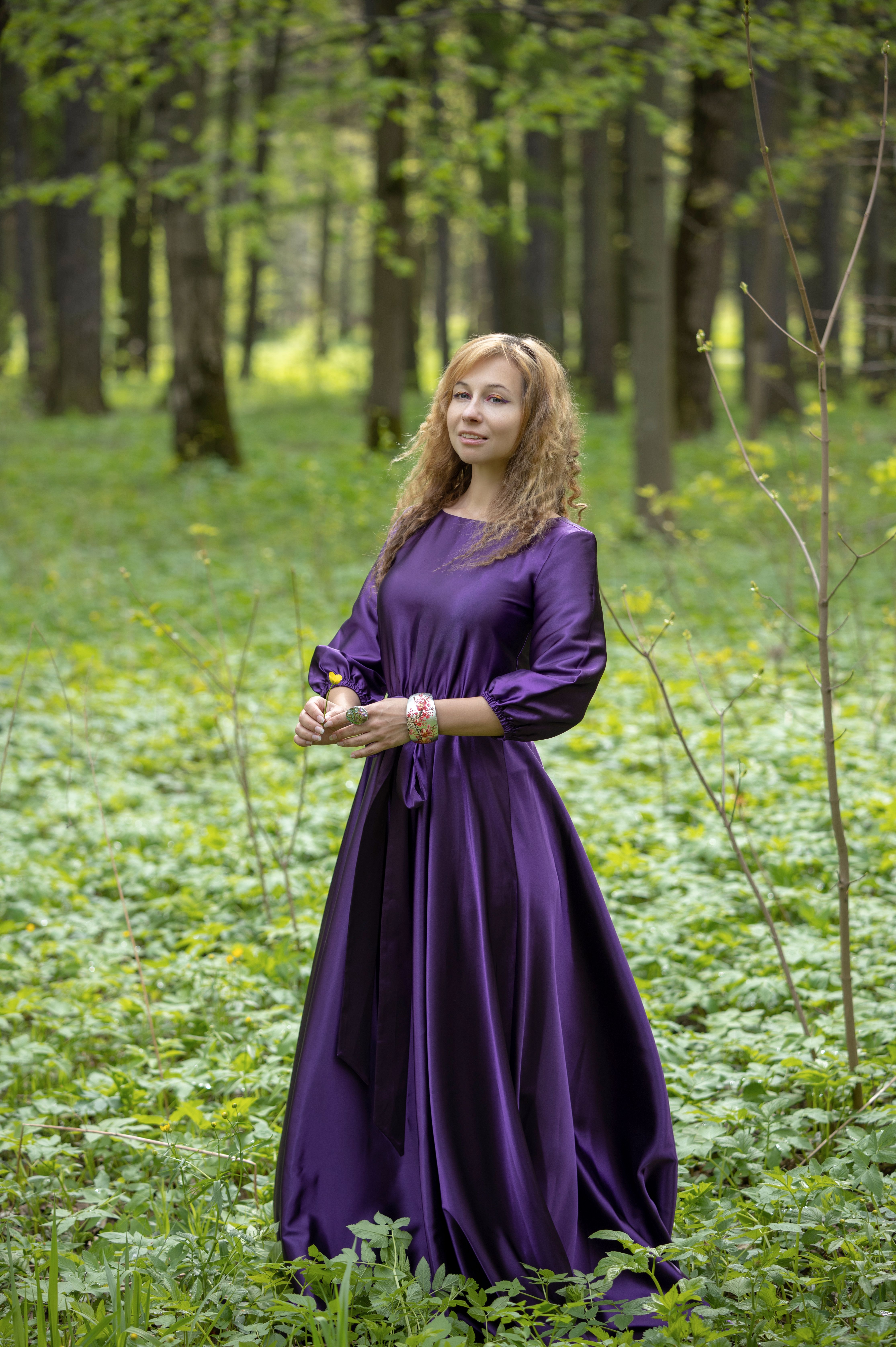 A woman in a purple dress standing in the woods · Free Stock Photo