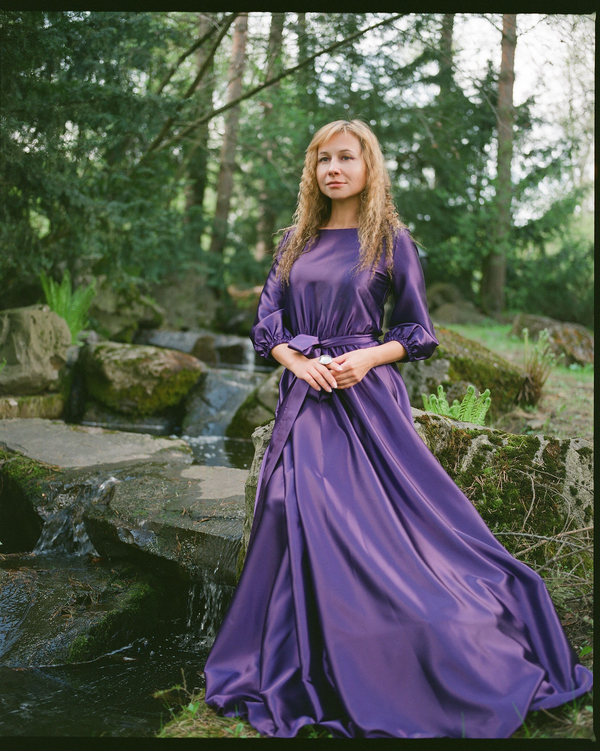 A woman in purple dress standing in a stream · Free Stock Photo