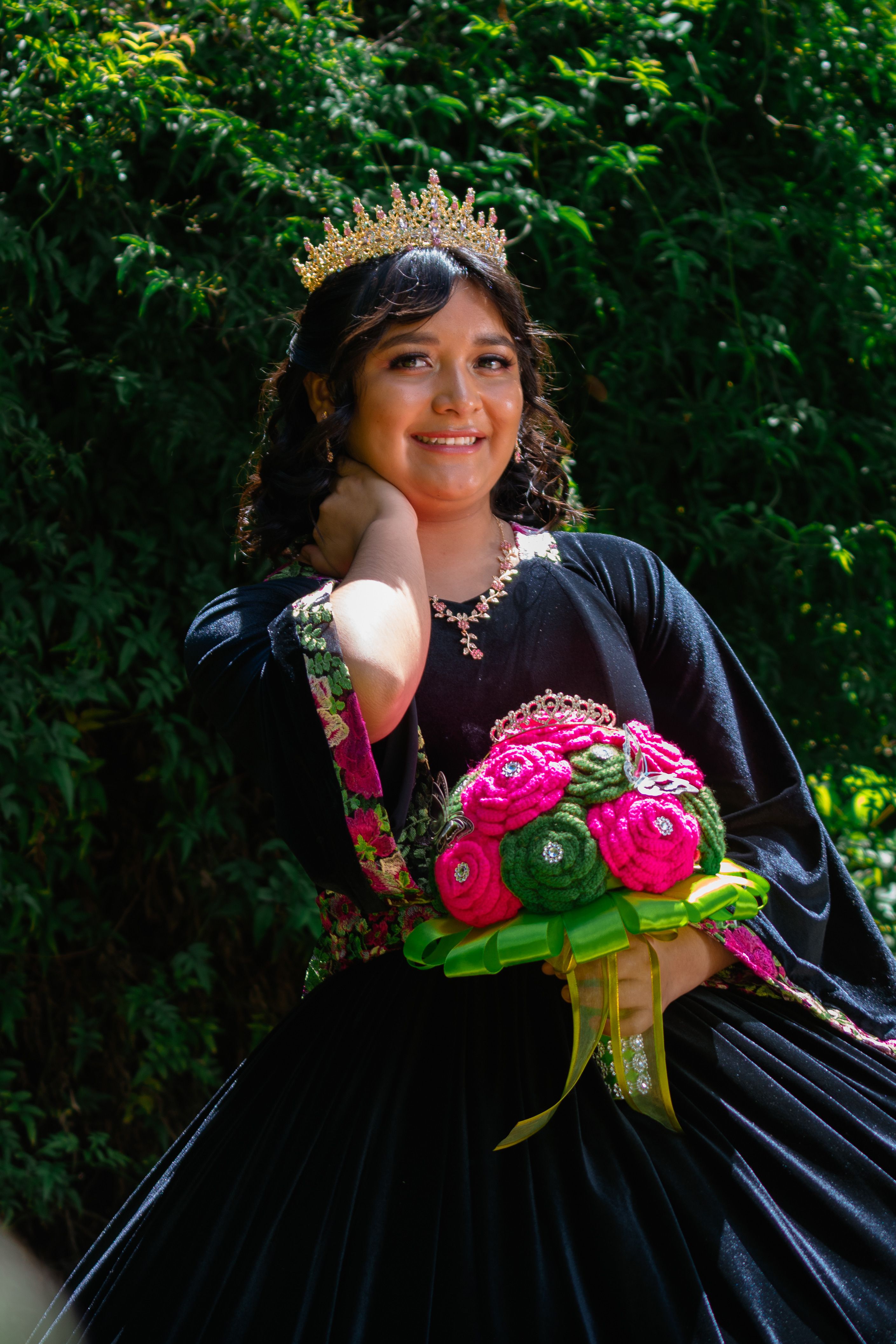A girl in a black dress holding a bouquet · Free Stock Photo