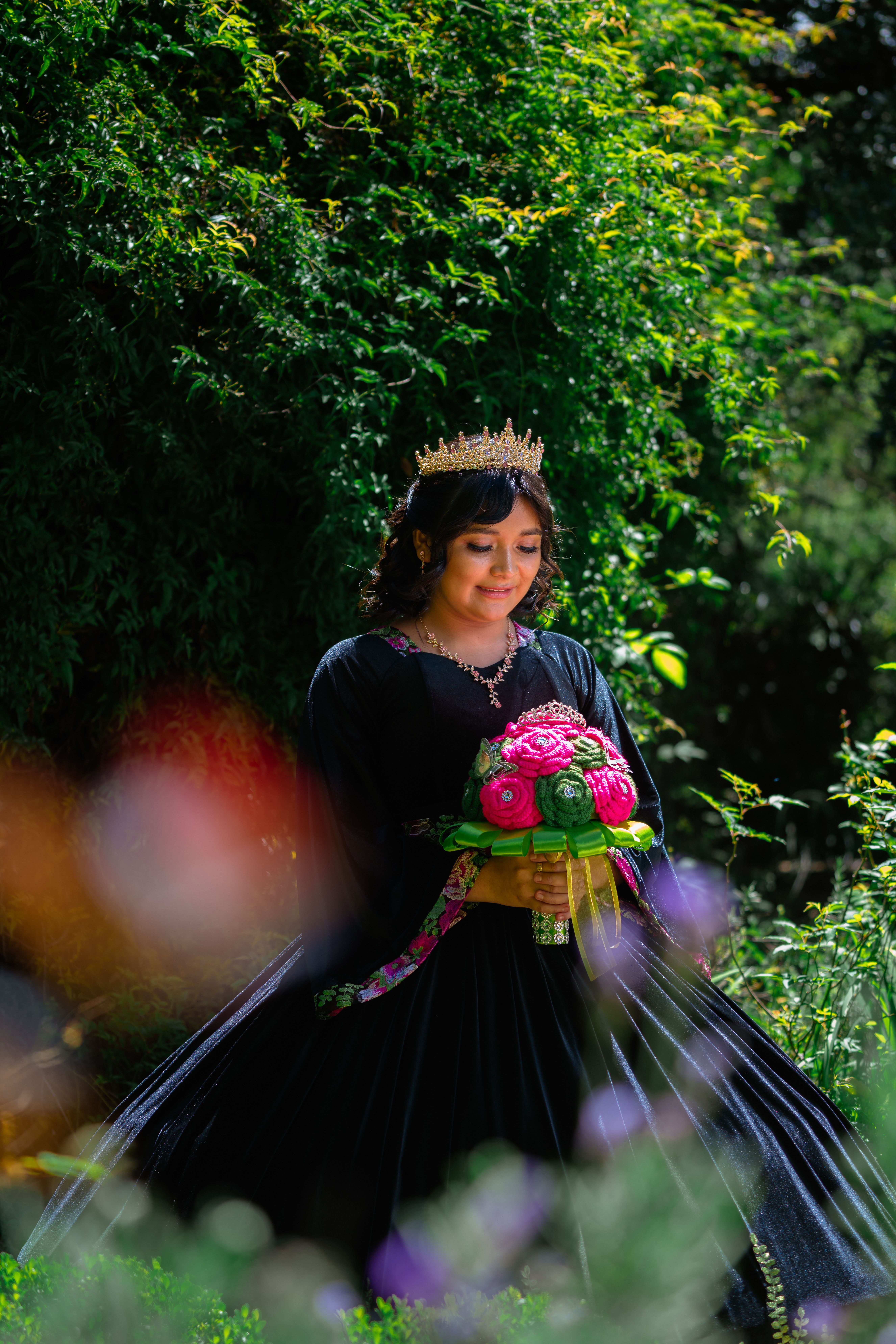 A woman in a black dress holding a bouquet · Free Stock Photo