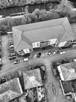 Black and white aerial photo of a residential neighborhood near a canal in Nottingham, England.