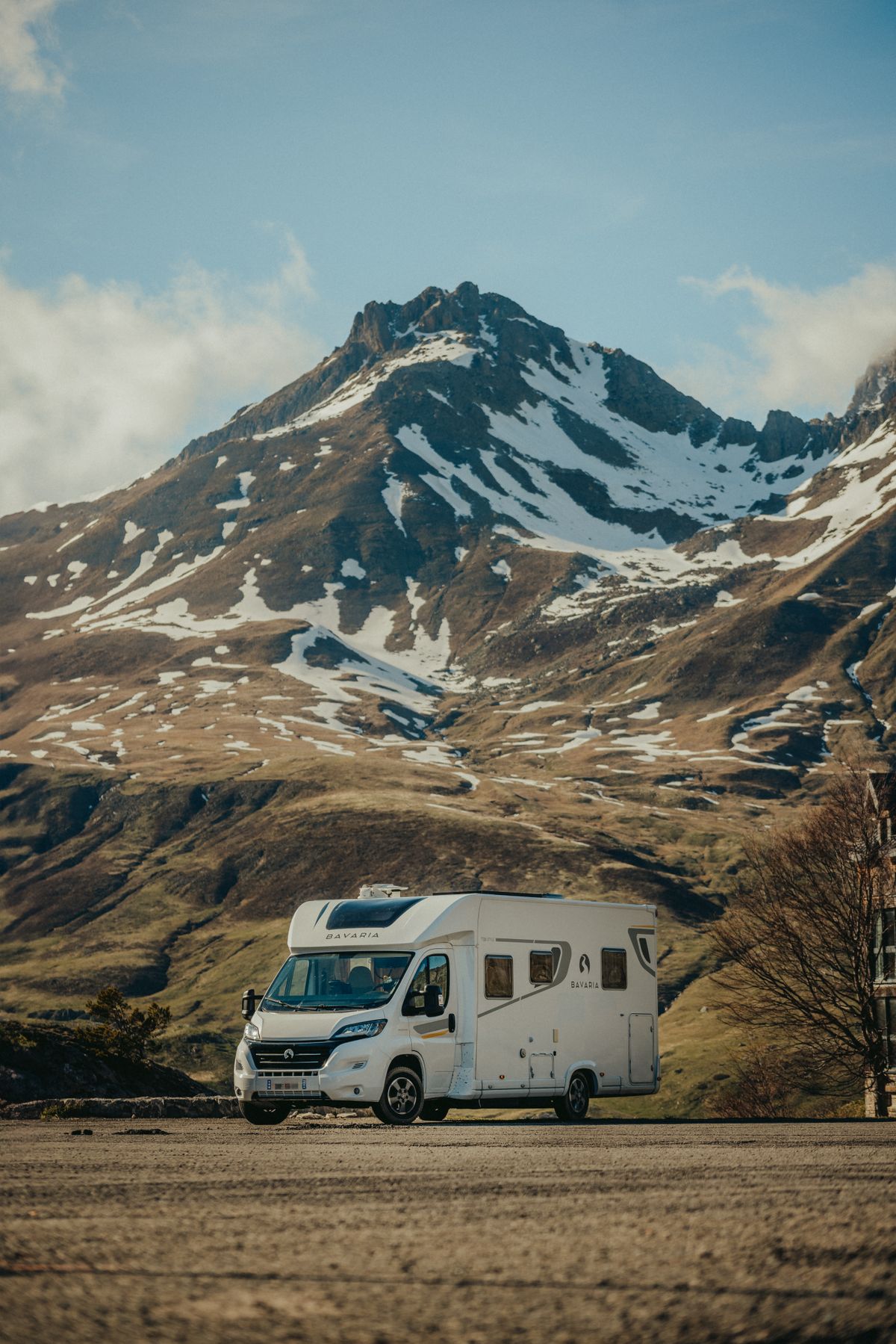 Camper in a Rocky Mountain Landscape · Free Stock Photo