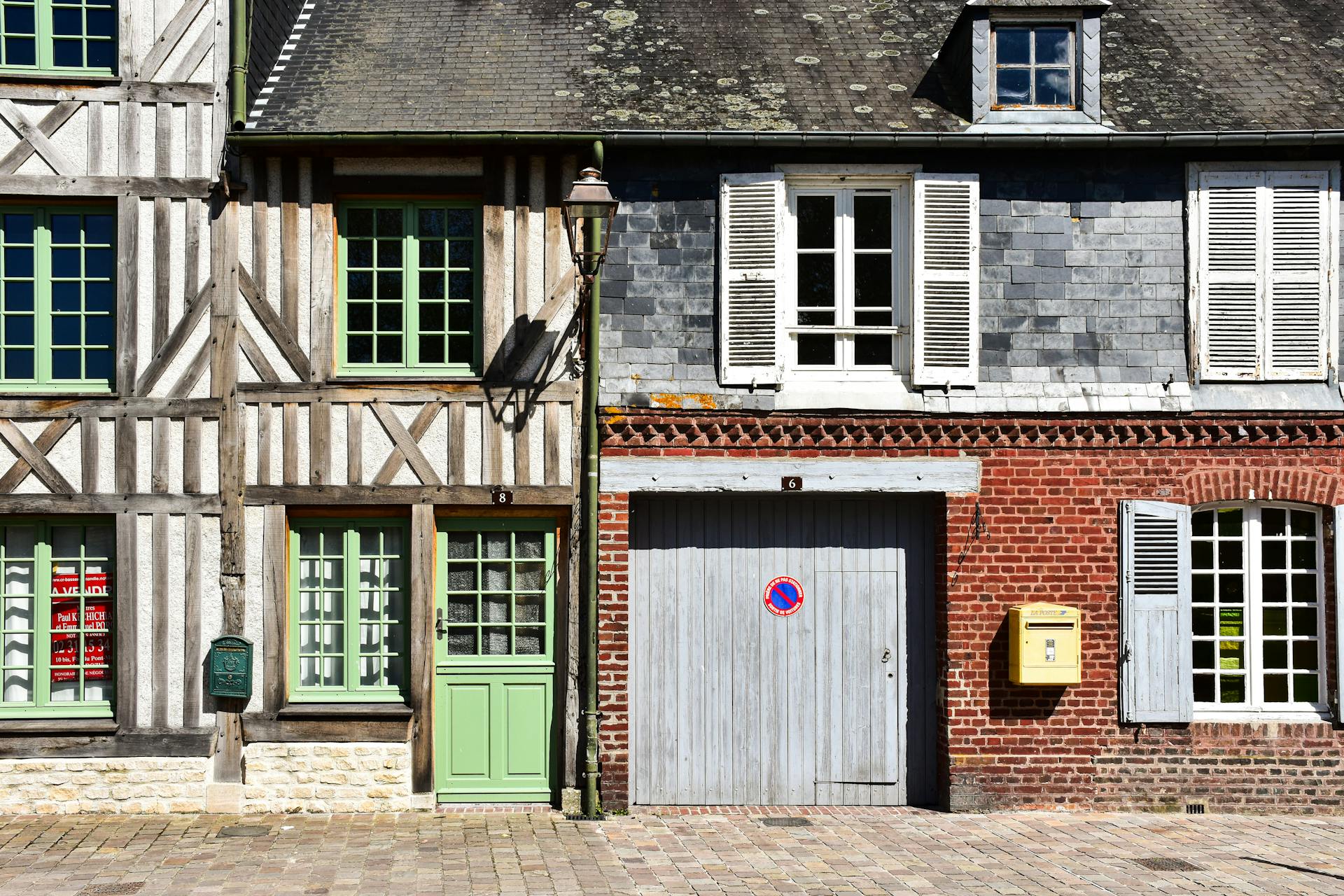 A row of old houses with windows and doors