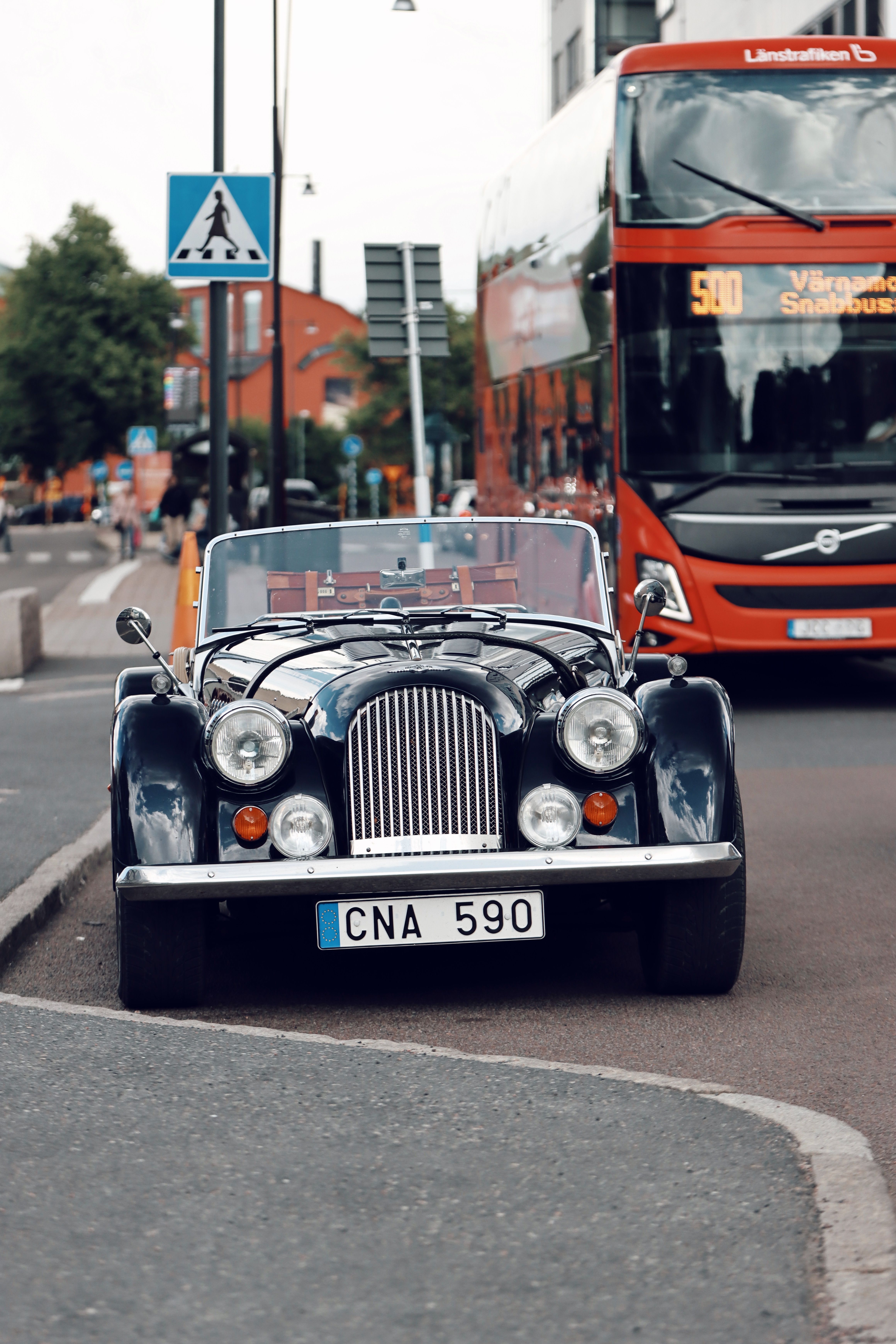 Vintage Morgan Plus Four parked on a busy street in Jönköping, Sweden.