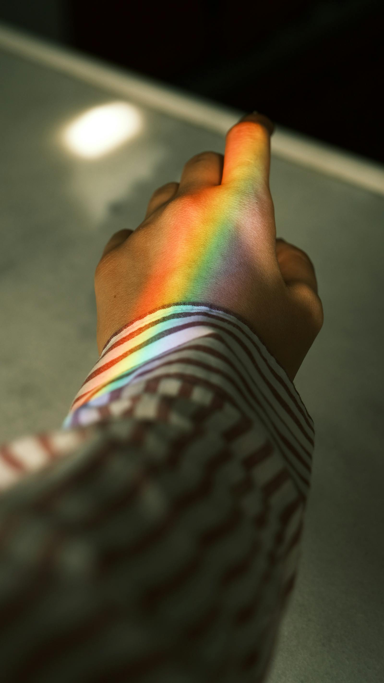 Blue and Orange Light Projeced on Left Hand of Person · Free Stock Photo