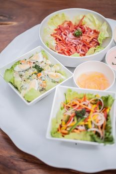 A variety of fresh salads featuring colorful vegetables and lettuce, perfect for a healthy meal.