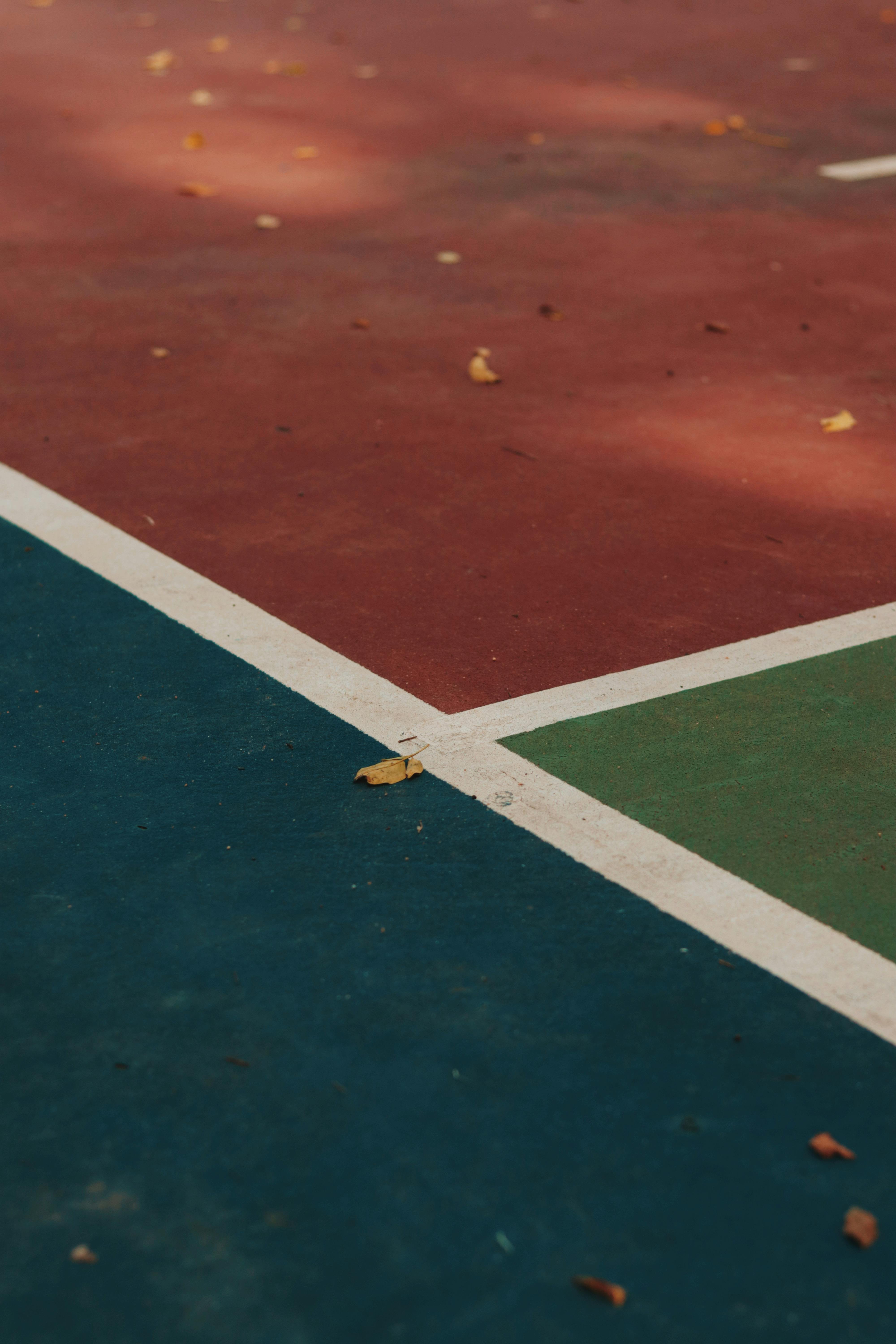 a tennis court with a blue red and green court