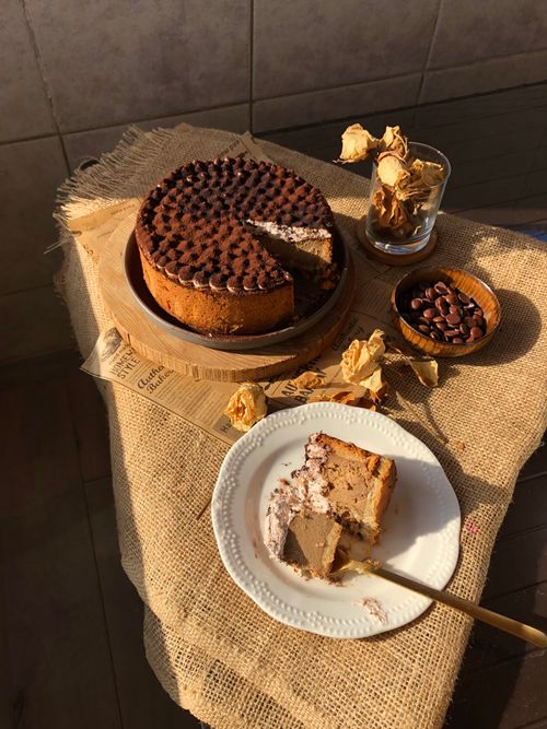 Free Delicious homemade chocolate cake with coffee beans on rustic burlap background, perfect for cozy settings. Stock Photo