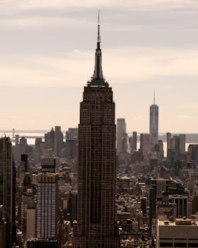 Stunning view of New York City skyline featuring the Empire State Building at sunset.