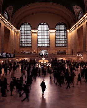 A lively scene capturing the bustling energy of Grand Central Terminal in New York City.