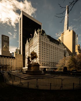 The Plaza Hotel amidst New York City's skyline at daytime, capturing a blend of historic and modern architecture.