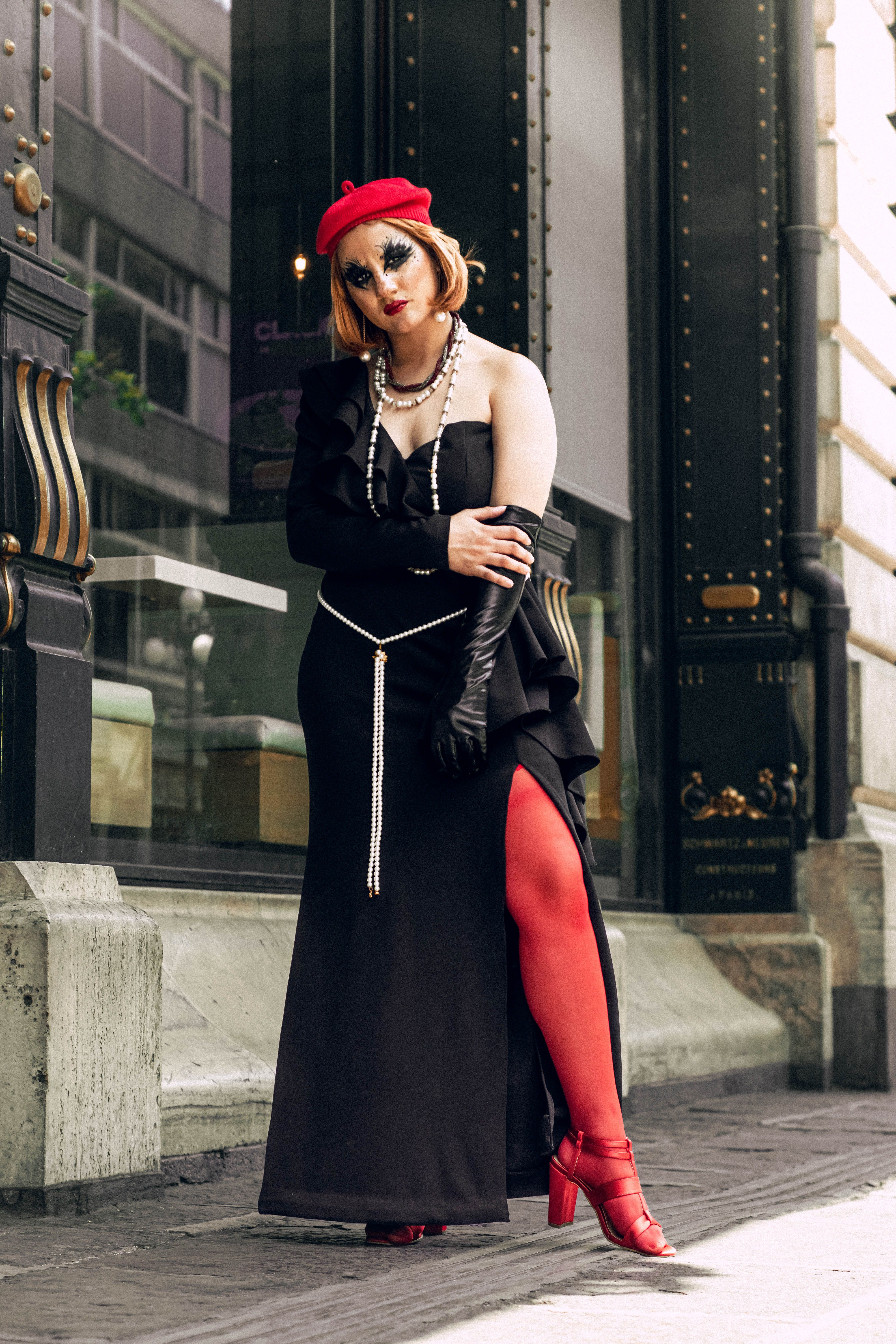 A woman in red stockings and a black dress  Free Stock Photo