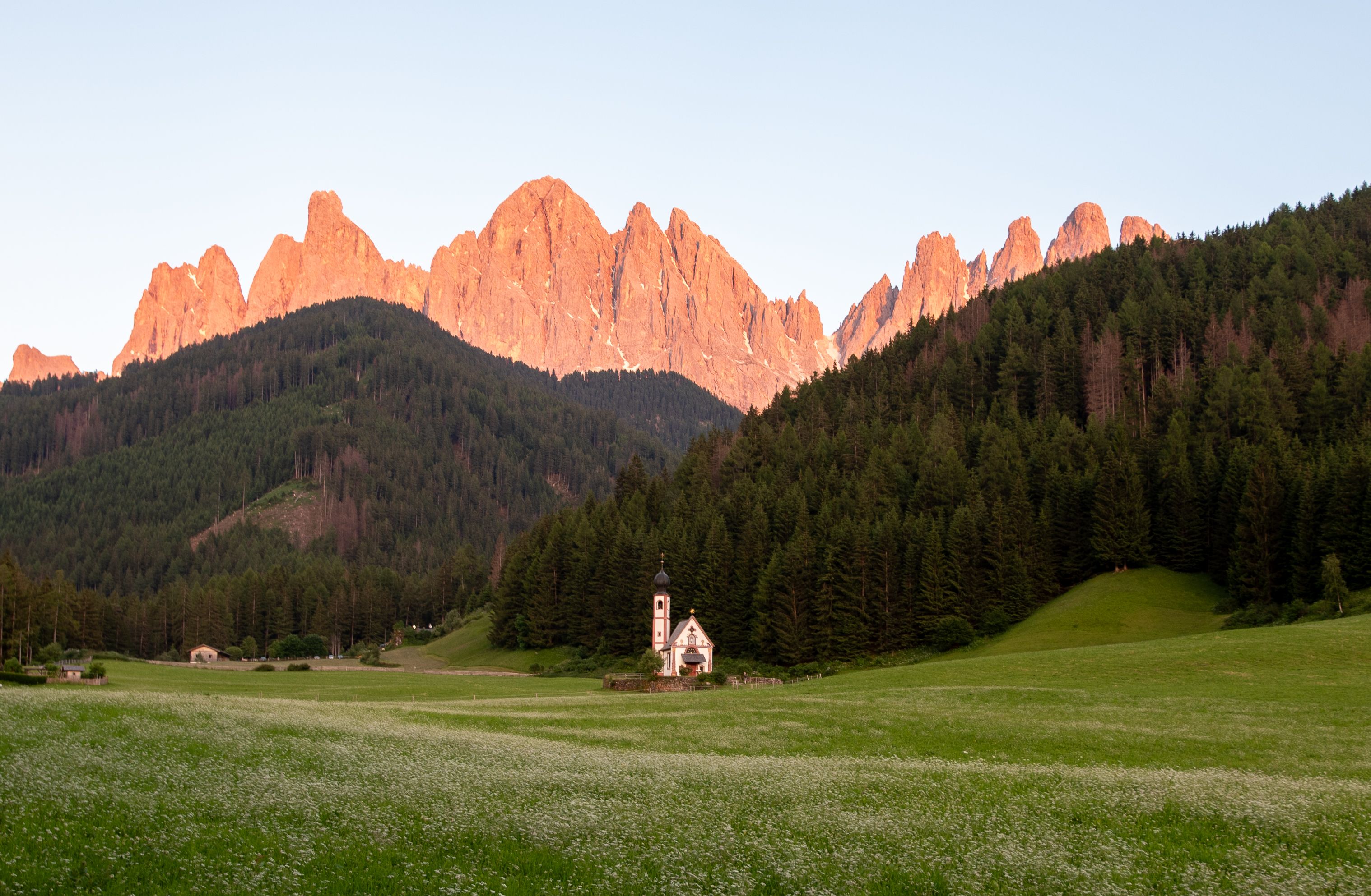 Scenic sunset view of Val di Funes with Santa Maddalena church and Dolomites mountains in Trentino-South Tyrol, Italy. Scenic sunset view of Val di Funes with Santa Maddalena church and Dolomites mountains in Trentino-South Tyrol, Italy.