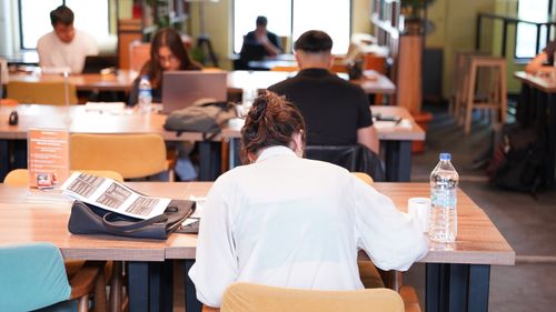 Free Group of people focused on studying and working at a library in Isparta. Stock Photo