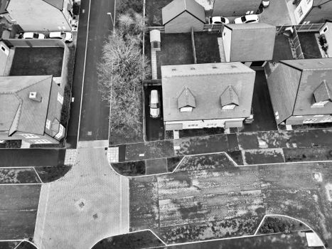 Black and white aerial shot of suburban homes in Central Bedfordshire, England, showcasing urban layout.