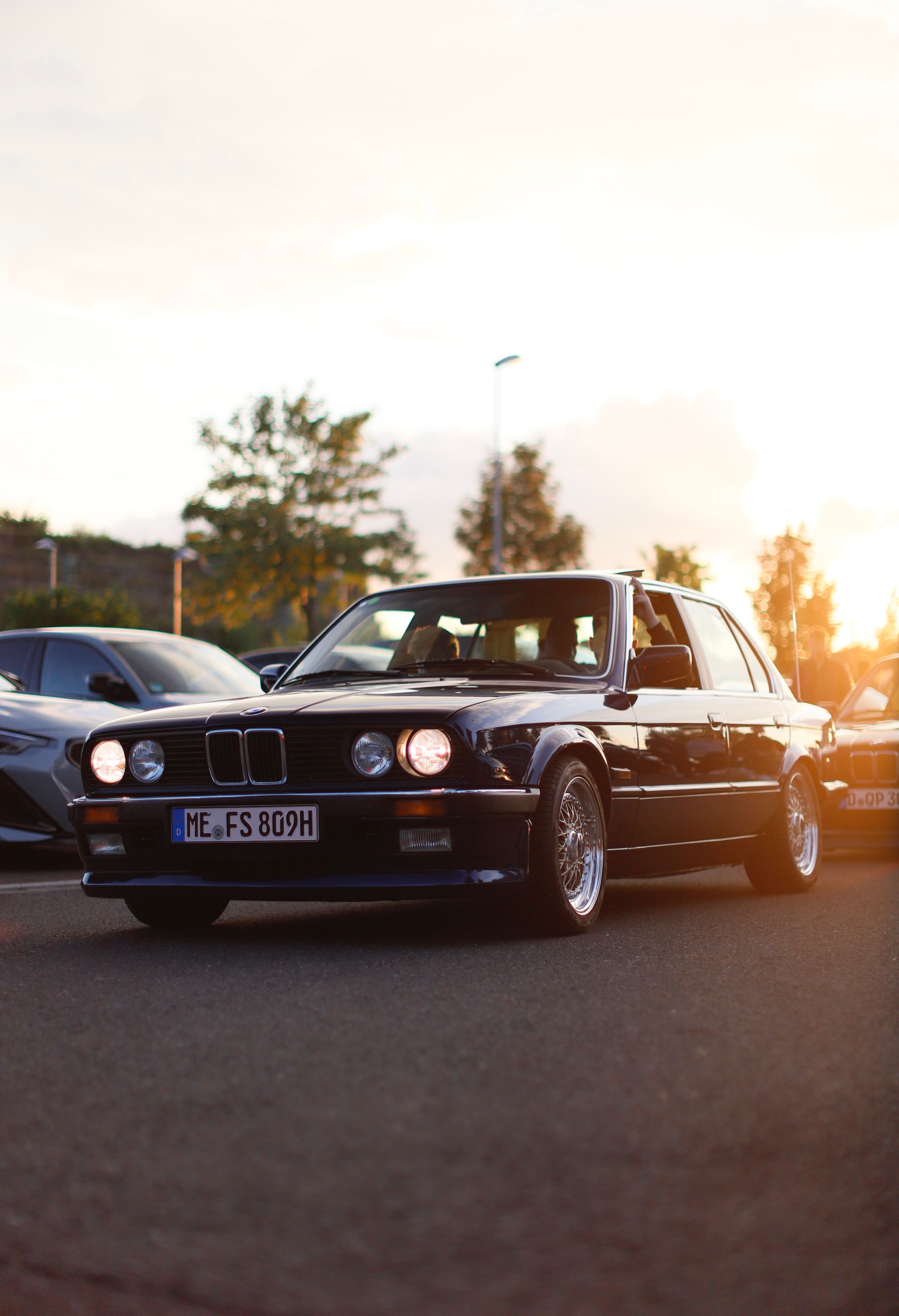 A black bmw car parked on the street · Free Stock Photo