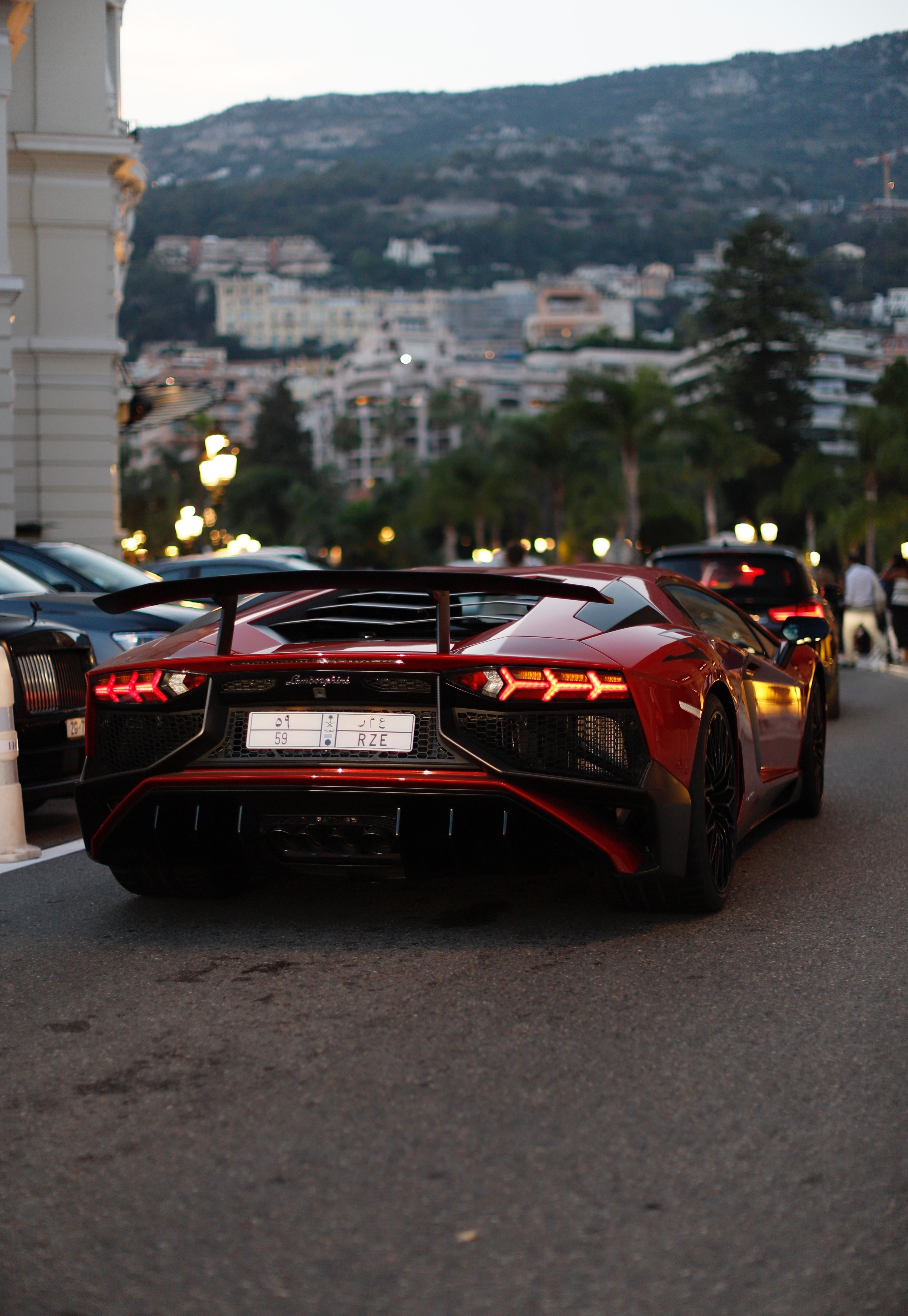 A sleek luxury sports car parked on an urban street, showcasing elegance and speed.