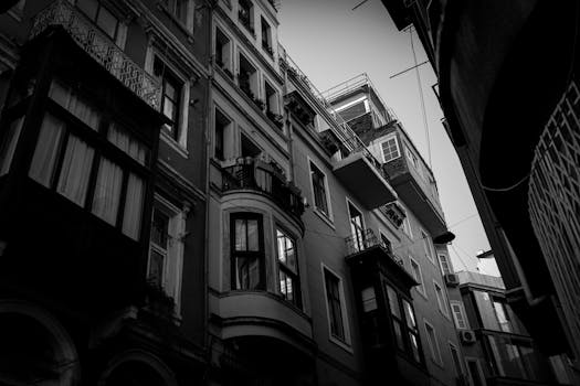 Explore intricate architectural details of a building in İstanbul, captured in striking monochrome.