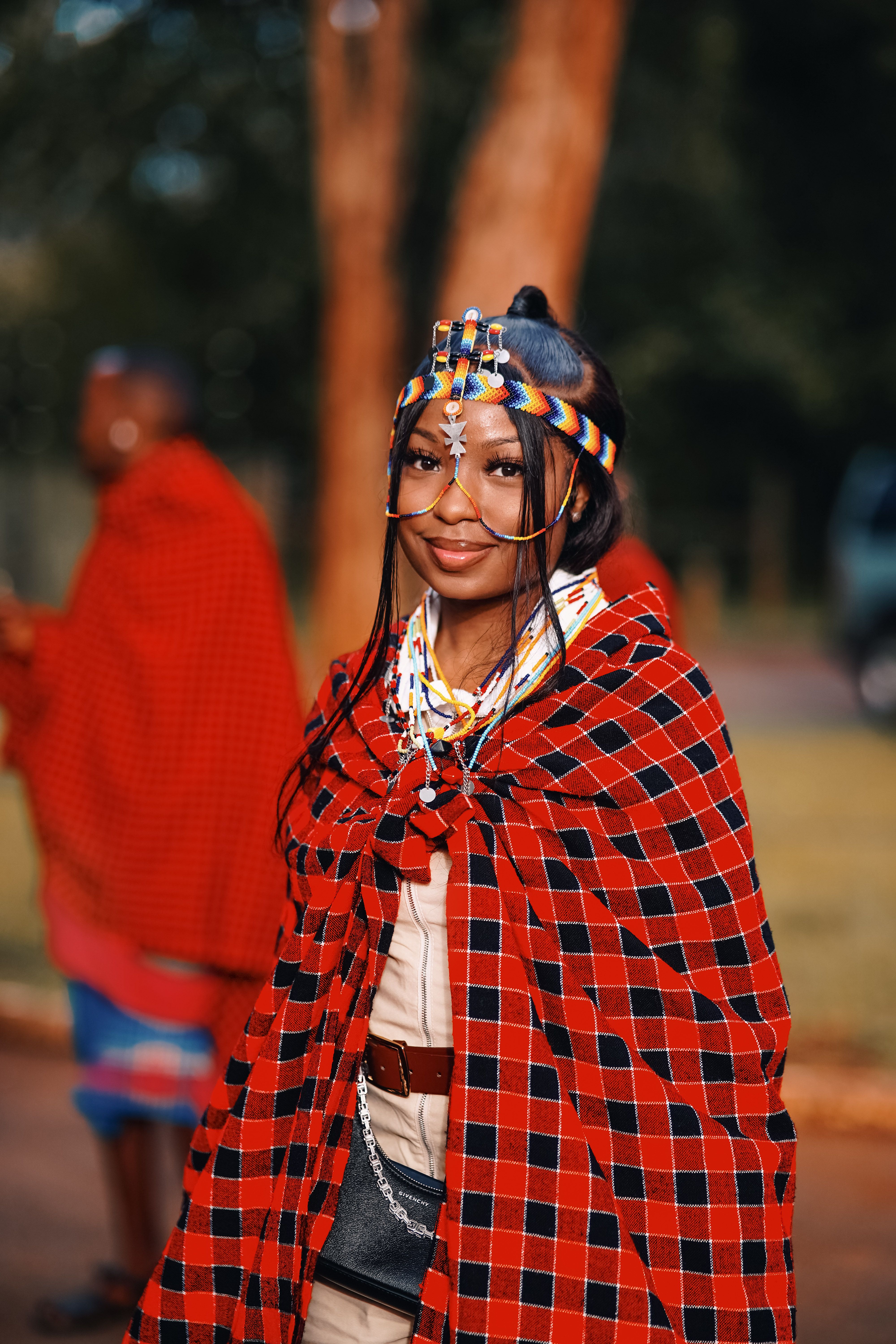Beautiful portrait of a Maasai woman in traditional attire at a cultural event in Nairobi, Kenya.
