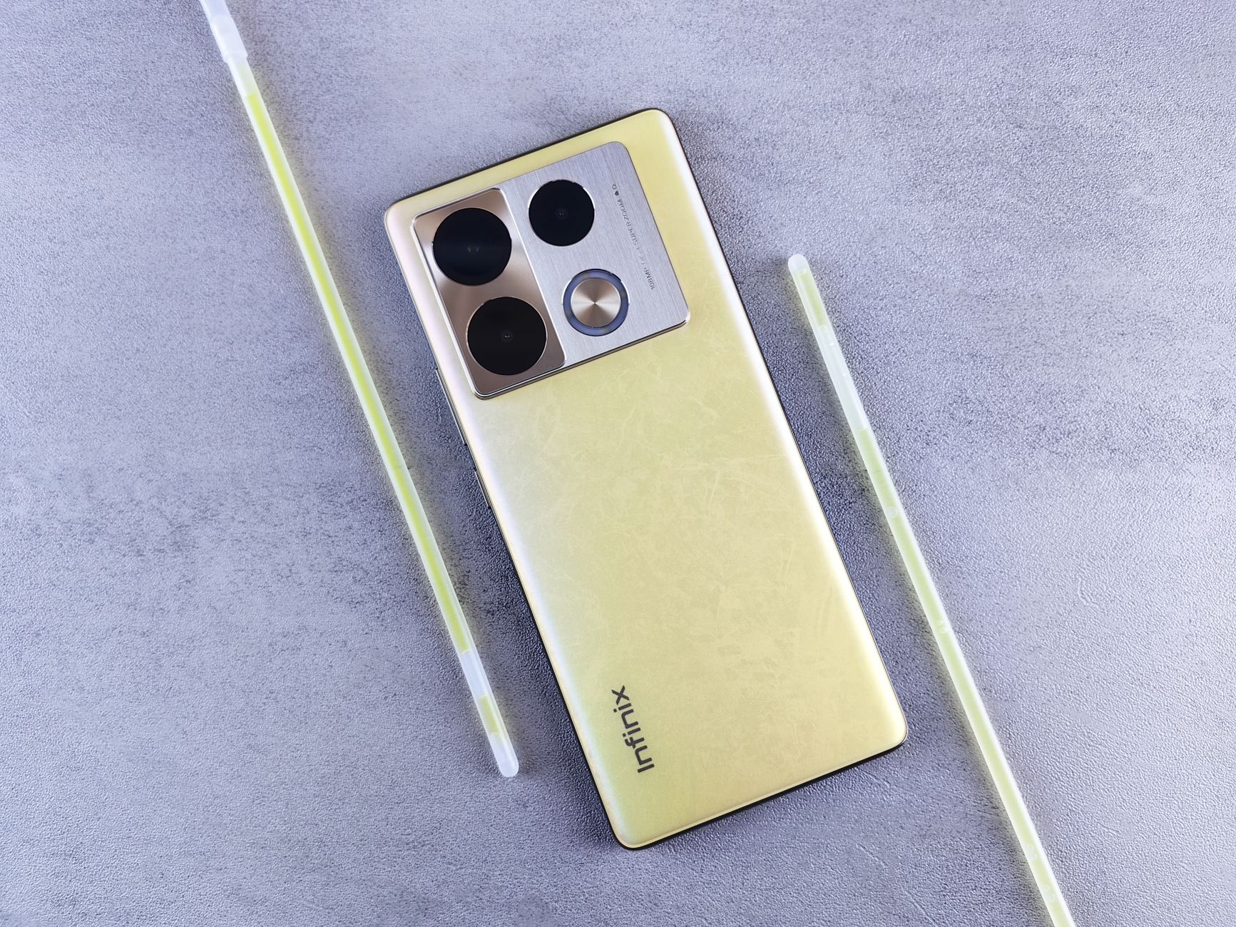 a smartphone displaying separate Gold Coins and Sweeps Coins balances beside a handwritten spending limit