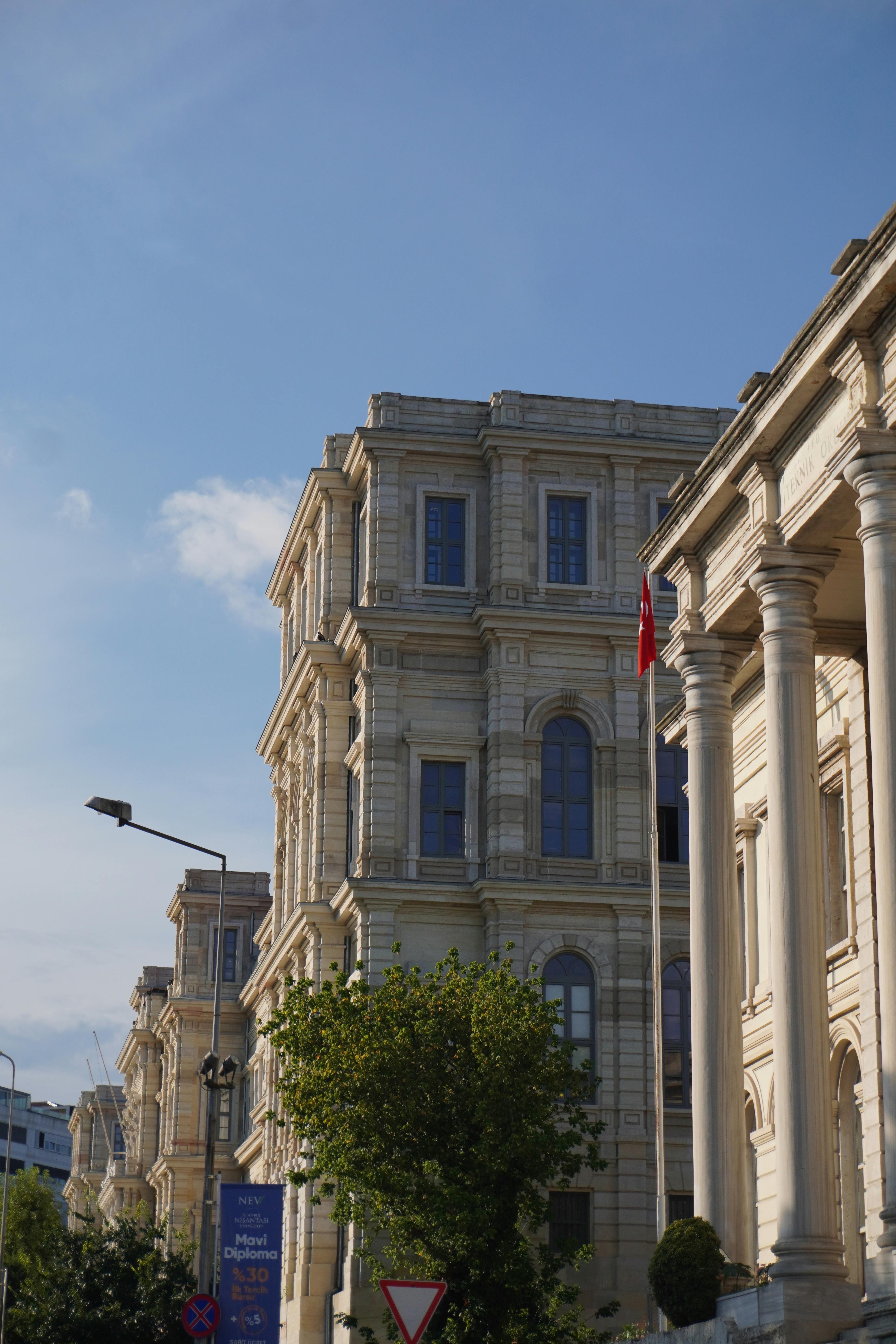 a building with columns and a clock on top