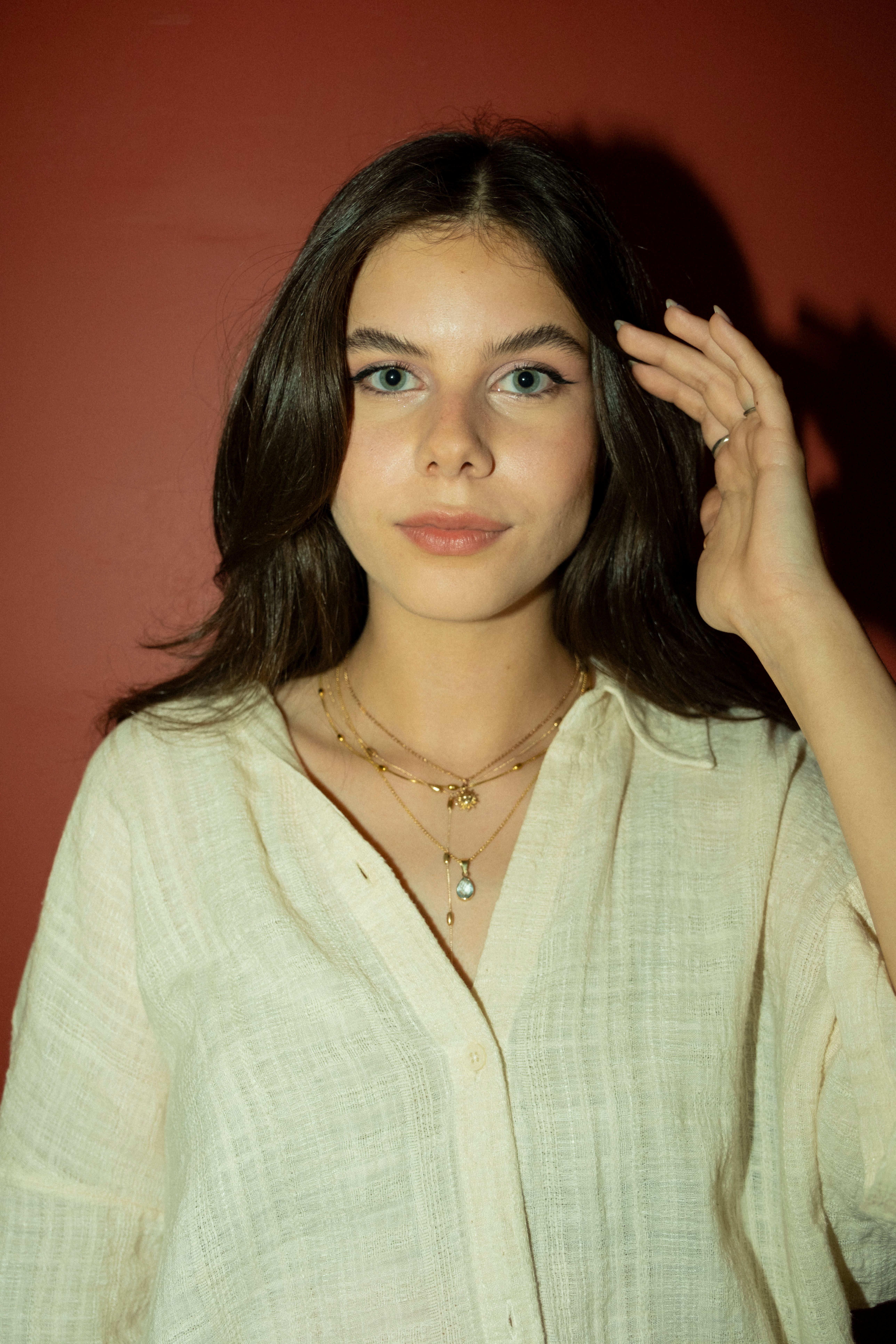 A woman in a white shirt posing for a photo · Free Stock Photo