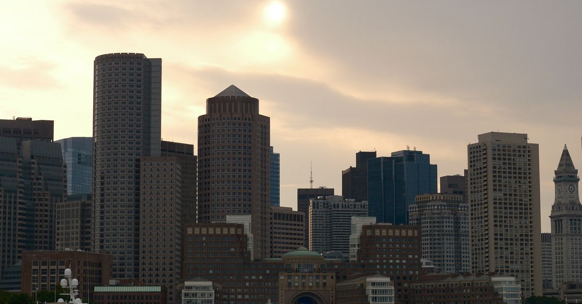 Boston harbor view with downtown skyline and historic brick buildings