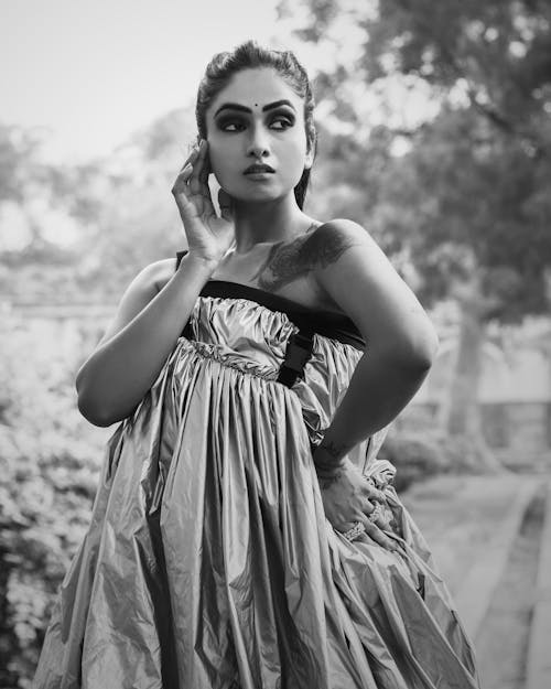 Woman in Gray Sleeveless Dress