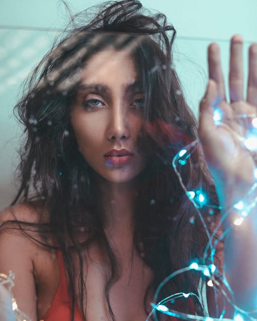 Woman Wearing Red Bra Holding Blue String Lights