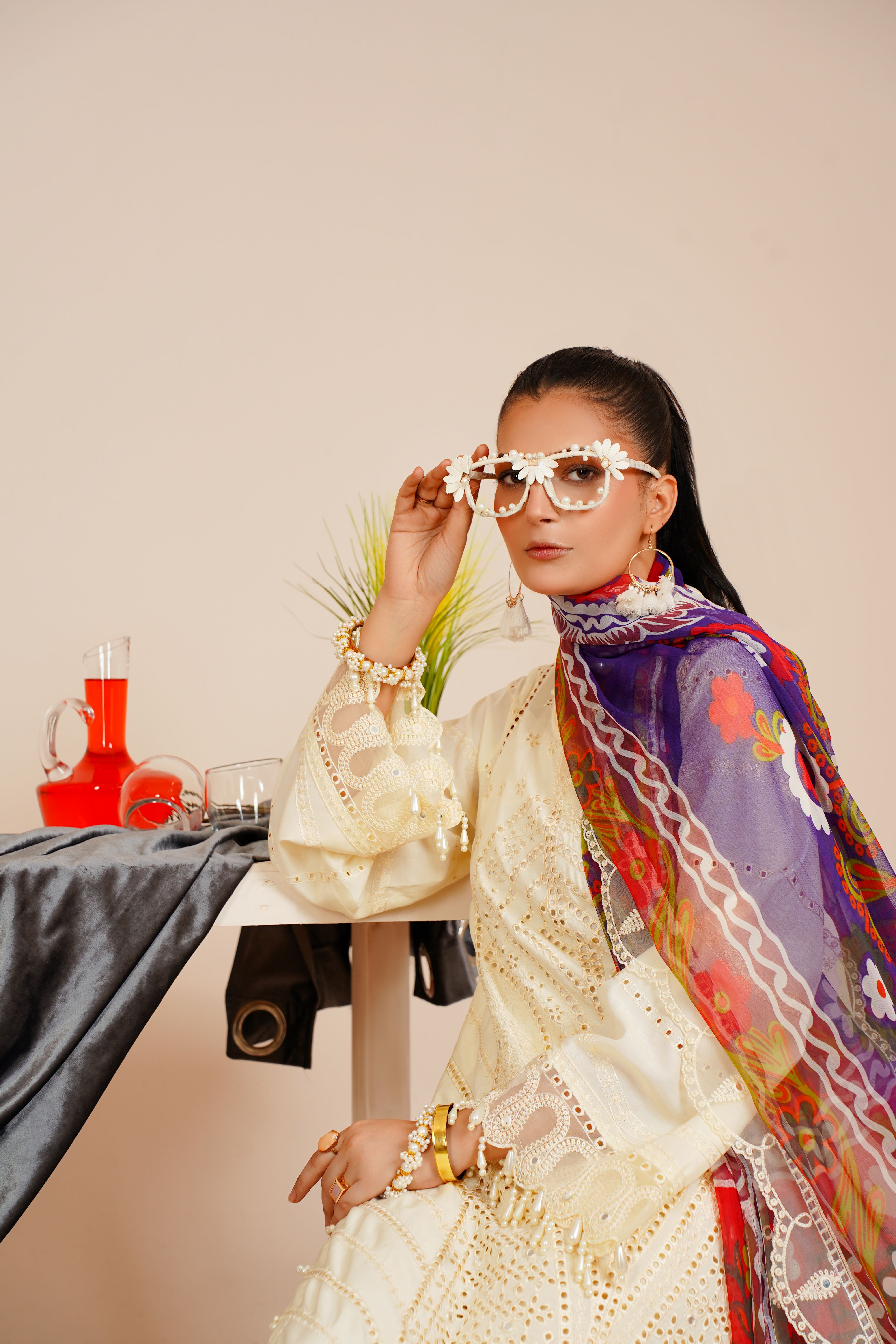 Stylish Pakistani woman in traditional dress, showcasing elegance and modern fashion.