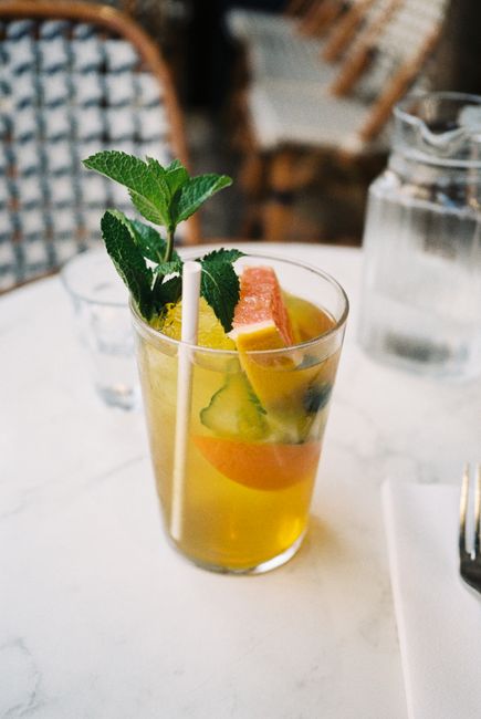 A bright citrus and mint mocktail served in a glass, perfect for a refreshing summer day.