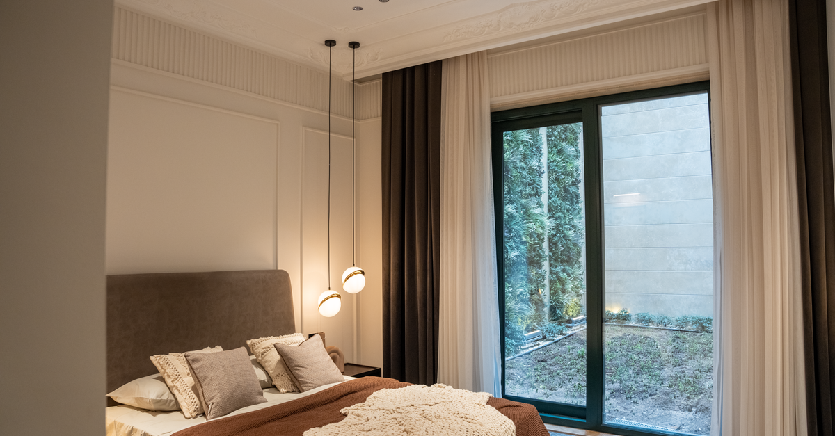 A modern hotel room featuring elegant decor and a cozy atmosphere.