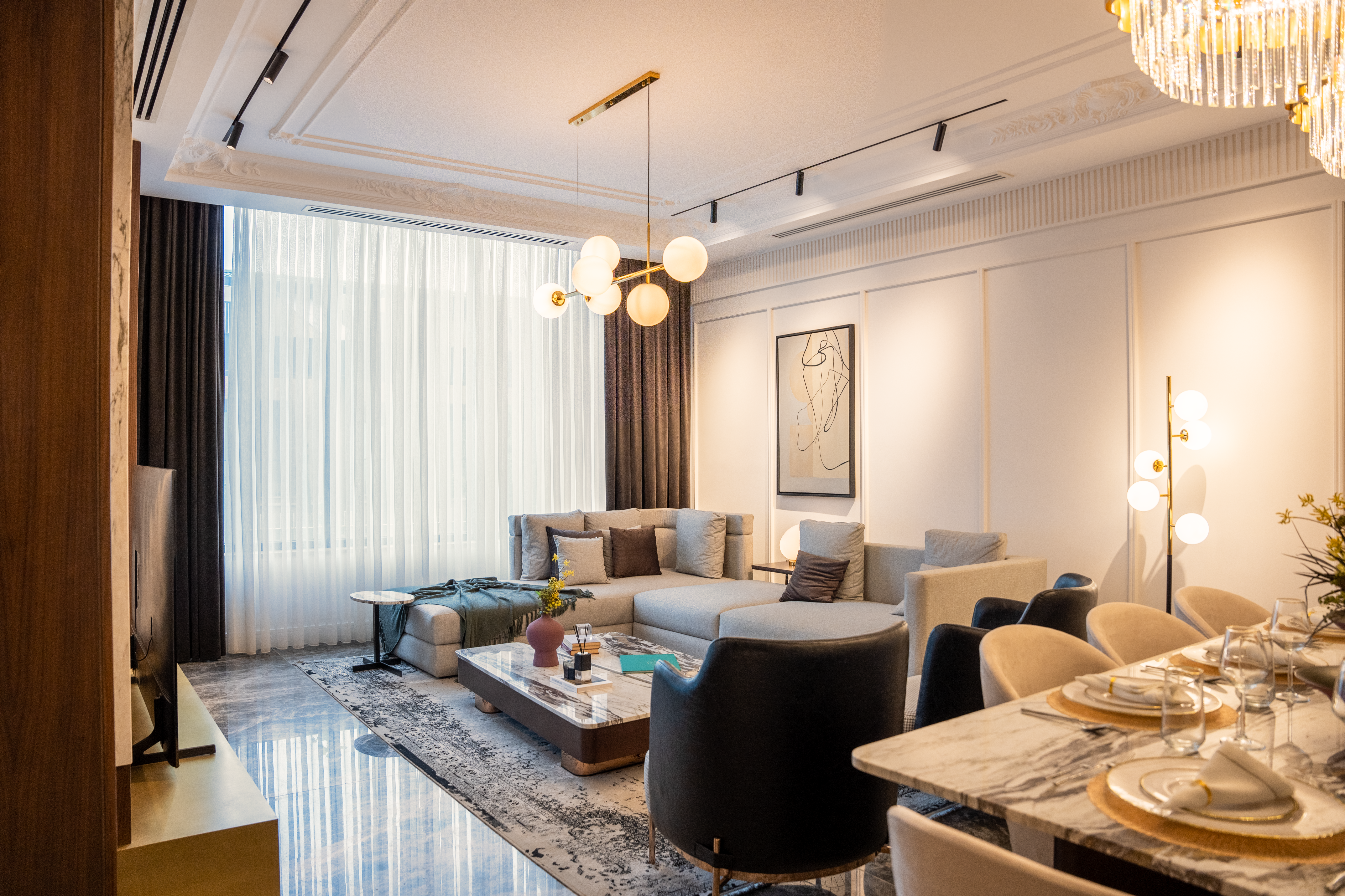 Spacious living area of a serviced apartment in Jeddah, Saudi Arabia, with a kitchenette