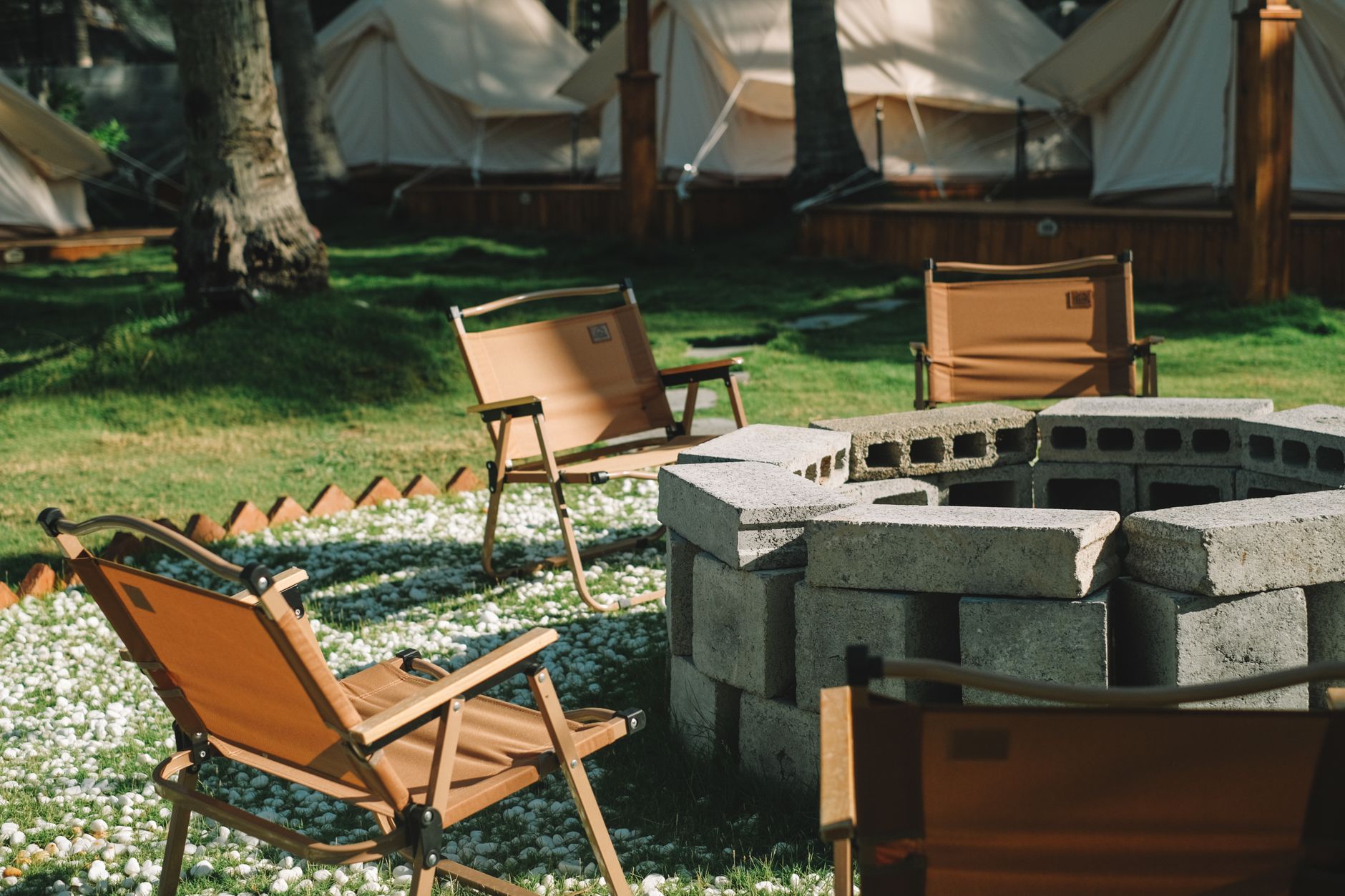 Serene outdoor seating area with chairs around a fire pit in Phan Thiet, Vietnam.