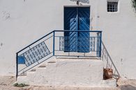 Explore the architectural charm of a blue doorway in Carthage, Tunisia, reflecting Mediterranean style.