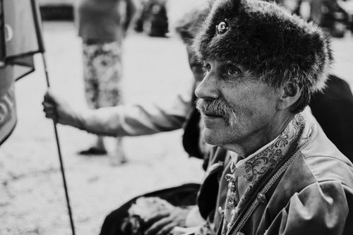 Free Black and white portrait of an elderly man in traditional Hungarian clothing outdoors. Stock Photo
