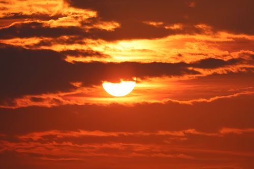 Free A striking sunset with clouds creating a dramatic scene in Stamford, CT. Stock Photo