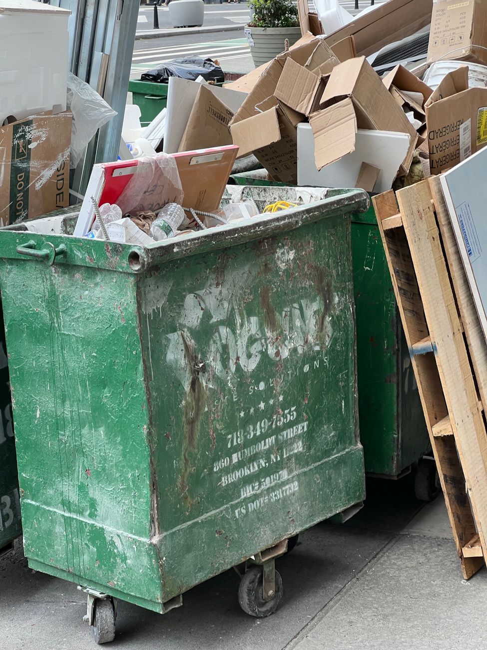 Commercial dumpster outside a business location