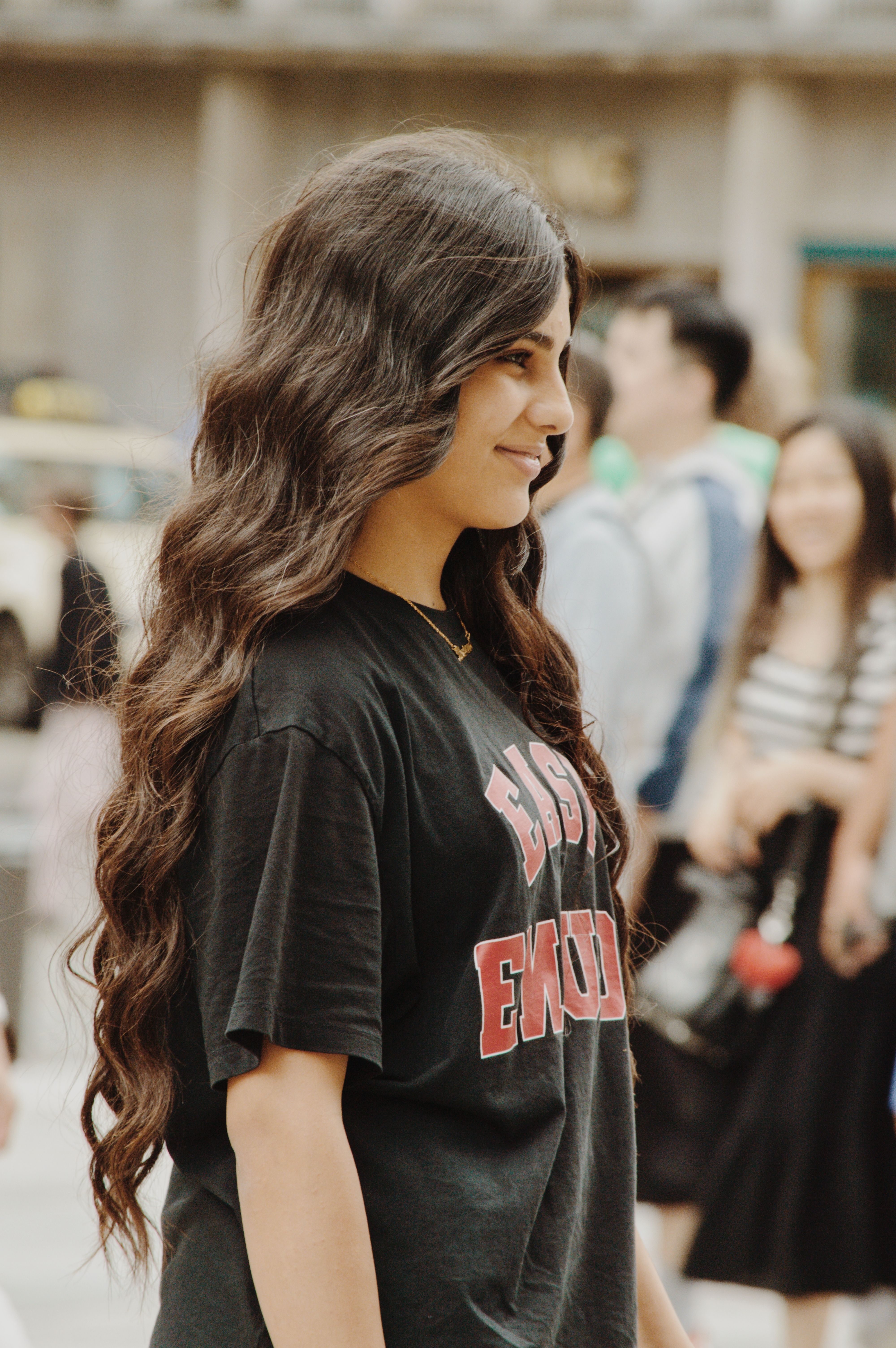 A woman with long hair wearing a black shirt · Free Stock Photo