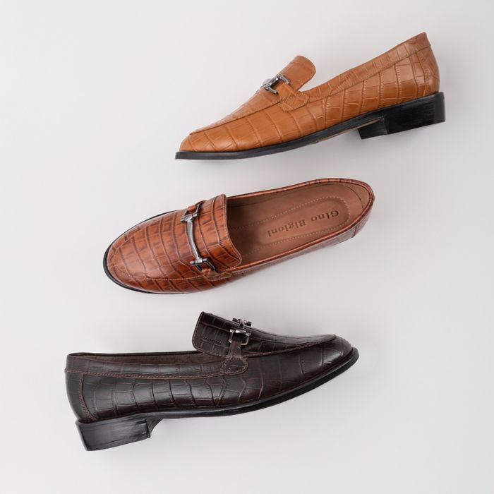Three pairs of brown leather loafers arranged on a white surface — photo by José Martin Segura Benites on Pexels
