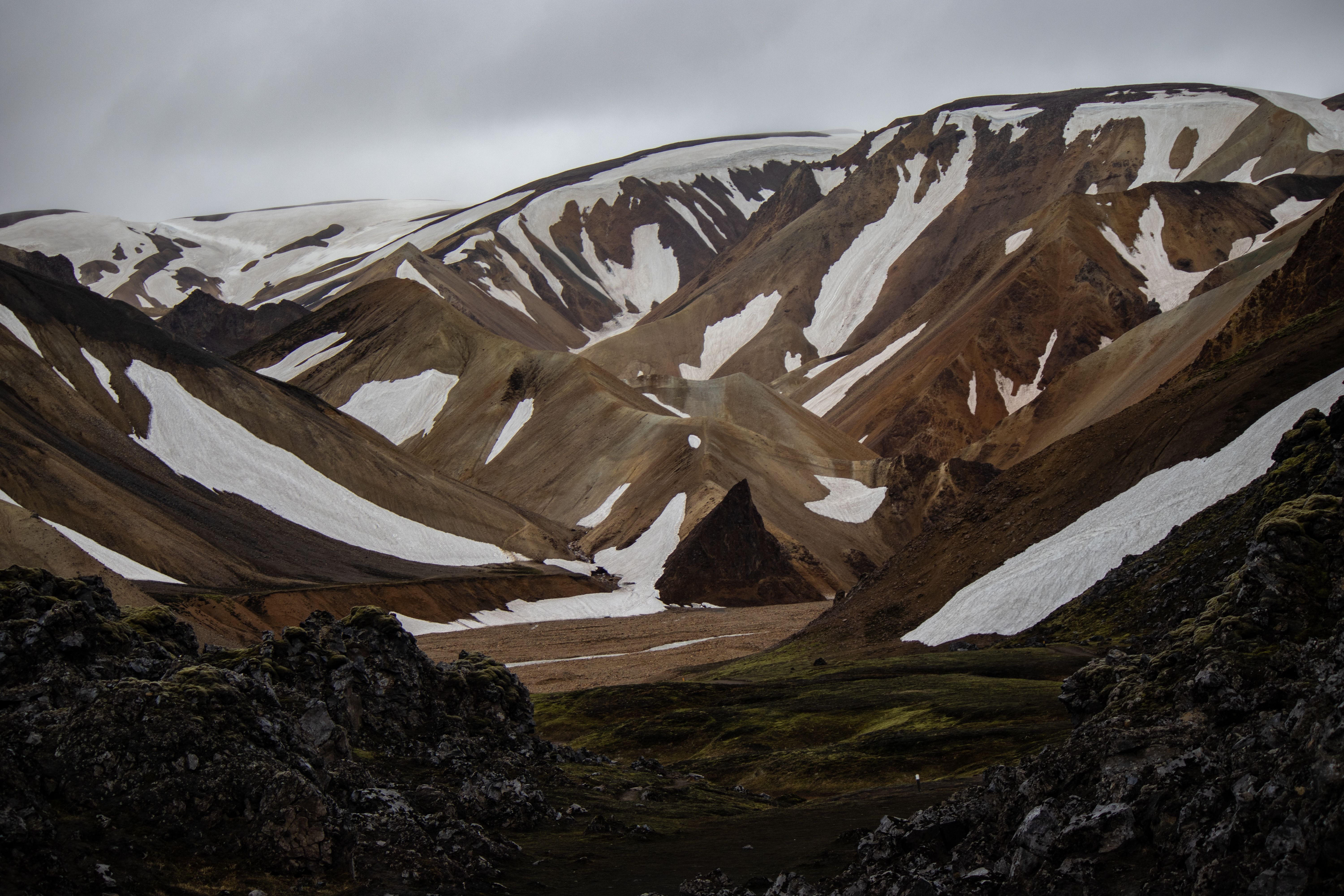 Breathtaking view of snow-capped mountains in Landmannalaugar, Iceland. Dramatic and picturesque landscape. Breathtaking view of snow-capped mountains in Landmannalaugar, Iceland. Dramatic and picturesque landscape.