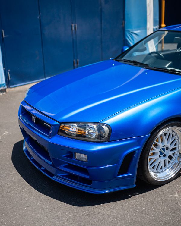 Blue Ricer Car A blue car with a white stripe on the hood · Free Stock Photo