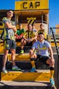 A group of soccer players posing for a photo on the steps of a stadium