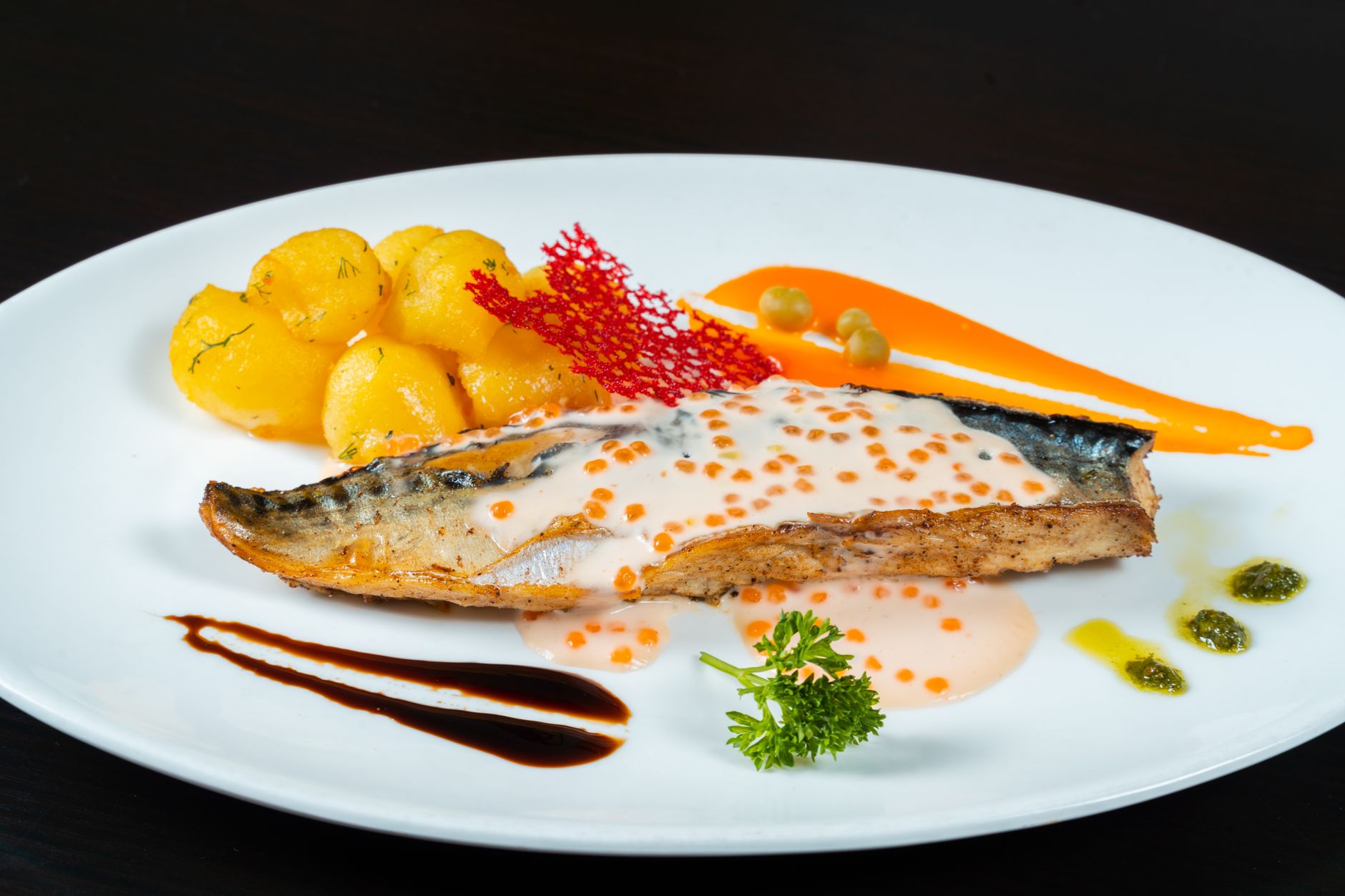 Broiled sockeye salmon with citrus glaze on a baking tray